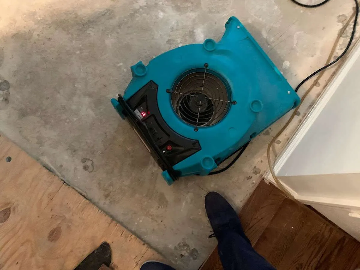 Air mover drying subfloor during Leak Detection & Repair in Brecksville